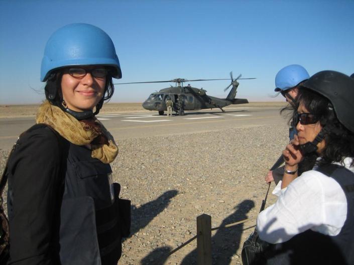 Elpida Rouka in front of helicopter